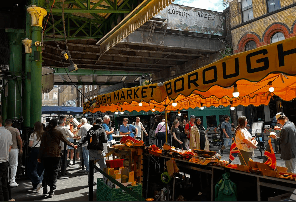 Rachel guiding a group through a bustling covered market